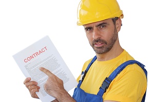 Builder pointing to a Building Contract