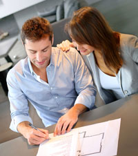 Building Contract Quality Review Service Man signing a Building Contract with his partner